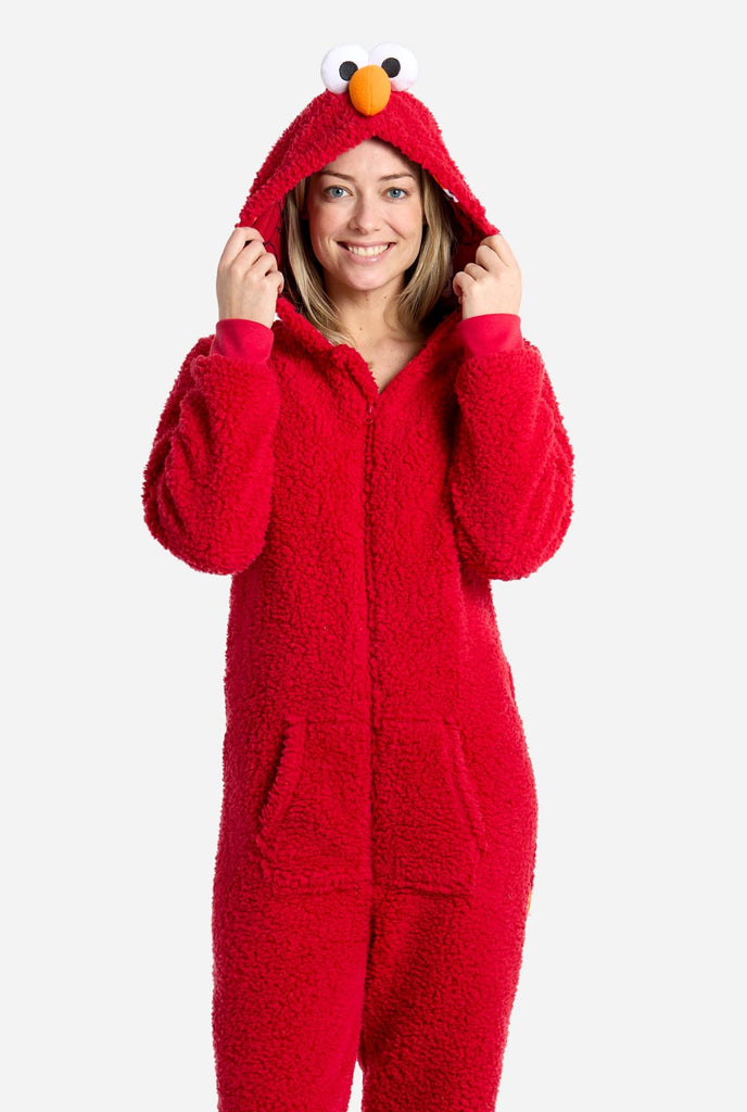 Woman wearing red pluche Elmo onesie for adults