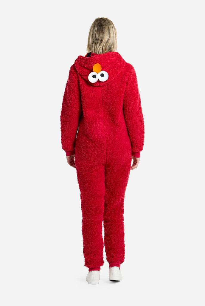 Woman wearing red pluche Elmo onesie for adults, view from the back