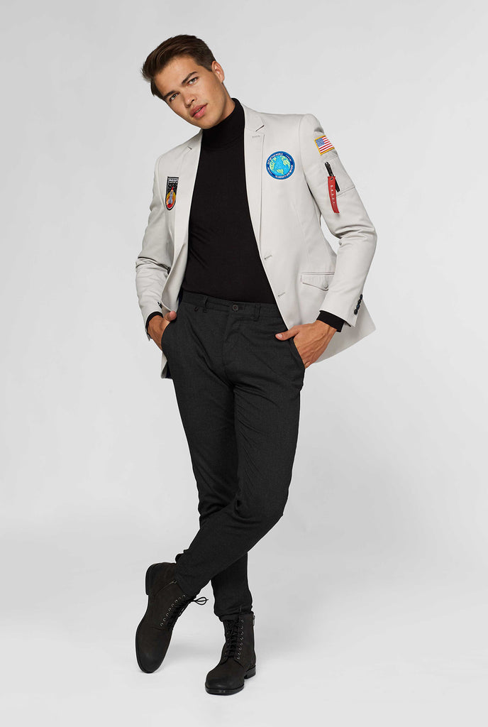 Light grey casual blazer with astronaut themed patches worn by man