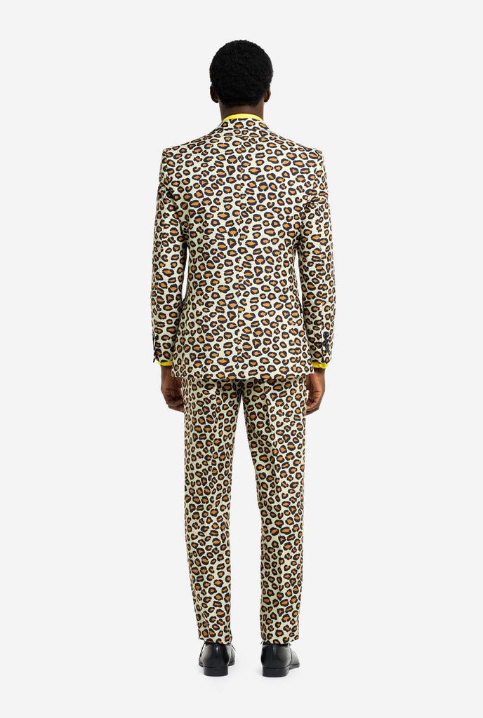 Image of a man wearing an OppoSuits The jag men's suit with panther print and yellow men's shirt. Suit consist of pants, jacket and tie.