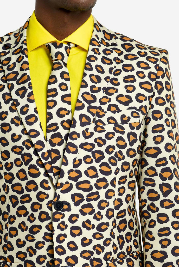 Image of a man wearing an OppoSuits The jag men's suit with panther print and yellow men's shirt. Suit consist of pants, jacket and tie.