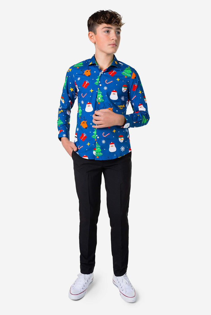 Teen wearing blue dress shirt with Christmas print