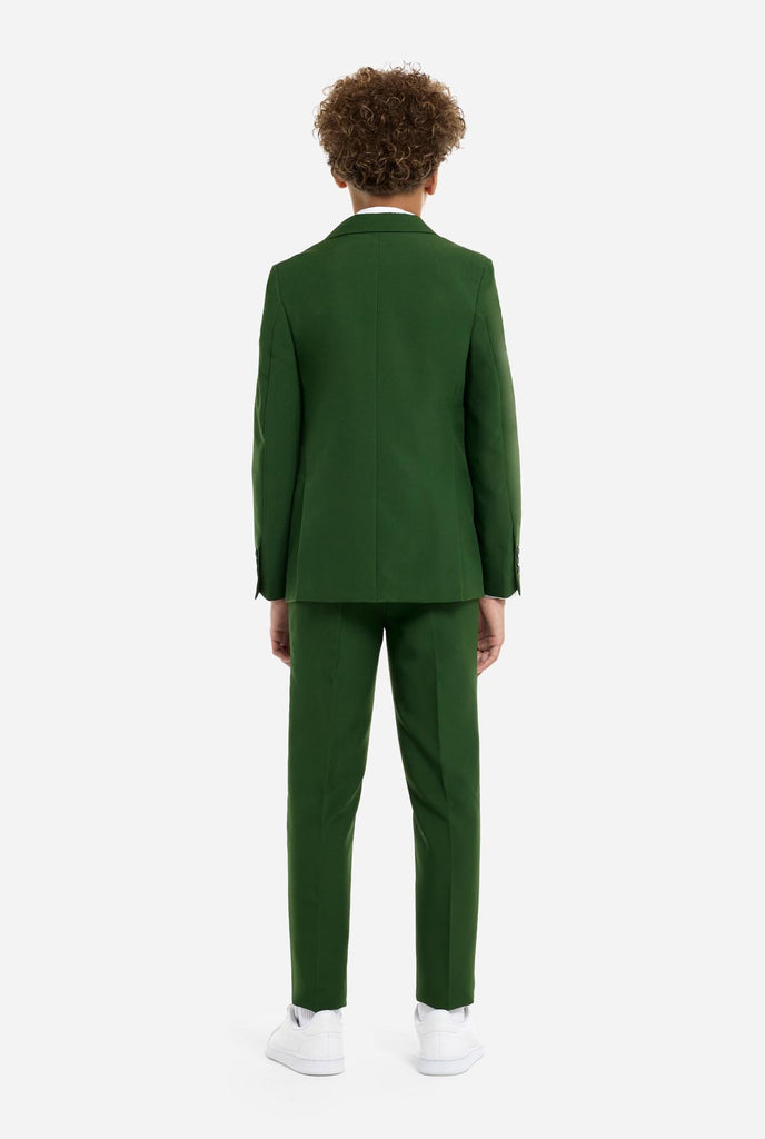 Teen wearing formal dark green suit, view from the back