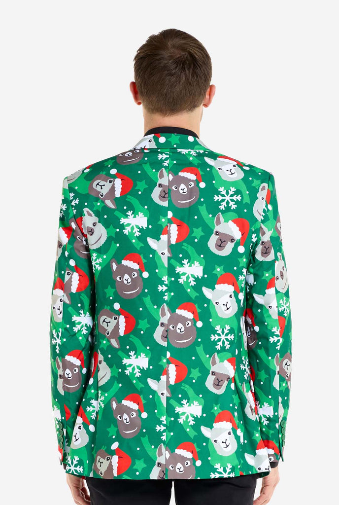 Man wearing green Christmas blazer for men with Christmas llamas. Man also wearing a black pants and black men's shirt. View from the back.