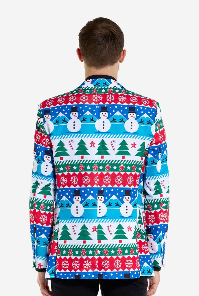 Man wearing Christmas blazer for men with Christmas winter figures. Man also wearing a black pants and black men's shirt. View from the back.