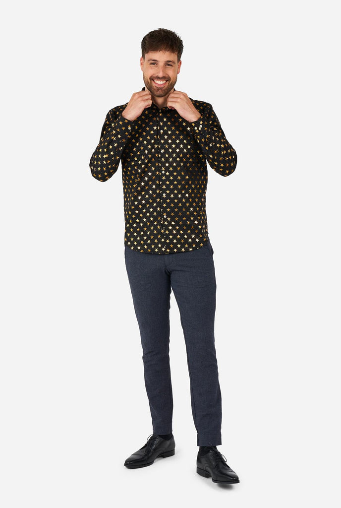 This image showcases a stylish men's dress shirt from OppoSuits, designed with a black base adorned with an eye-catching gold star pattern. The shirt has a sleek and contemporary fit, perfect for those who want to add a touch of flair to their wardrobe. Ideal for festive occasions, parties, or making a bold statement, this shirt combines elegance with a unique, playful twist. 