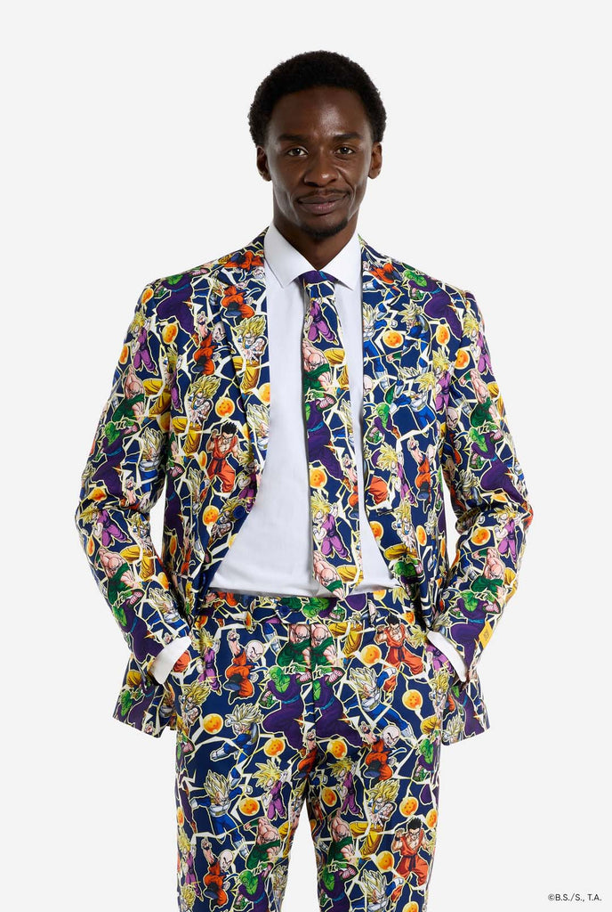 Man wearing all over print men's suit with Dragon Ball Z print which shows the Dragon Ball characters. Suit consists of blazer, pant and tie.