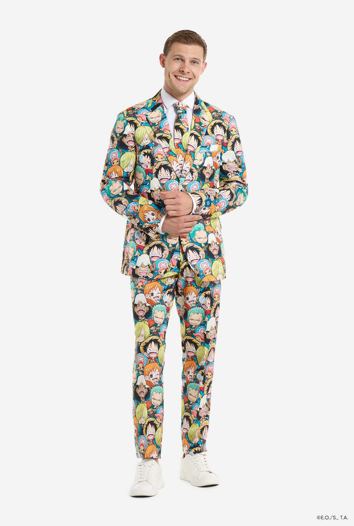 Man is wearing a men's suit with all over One piece print with One Piece characters. Full body image.