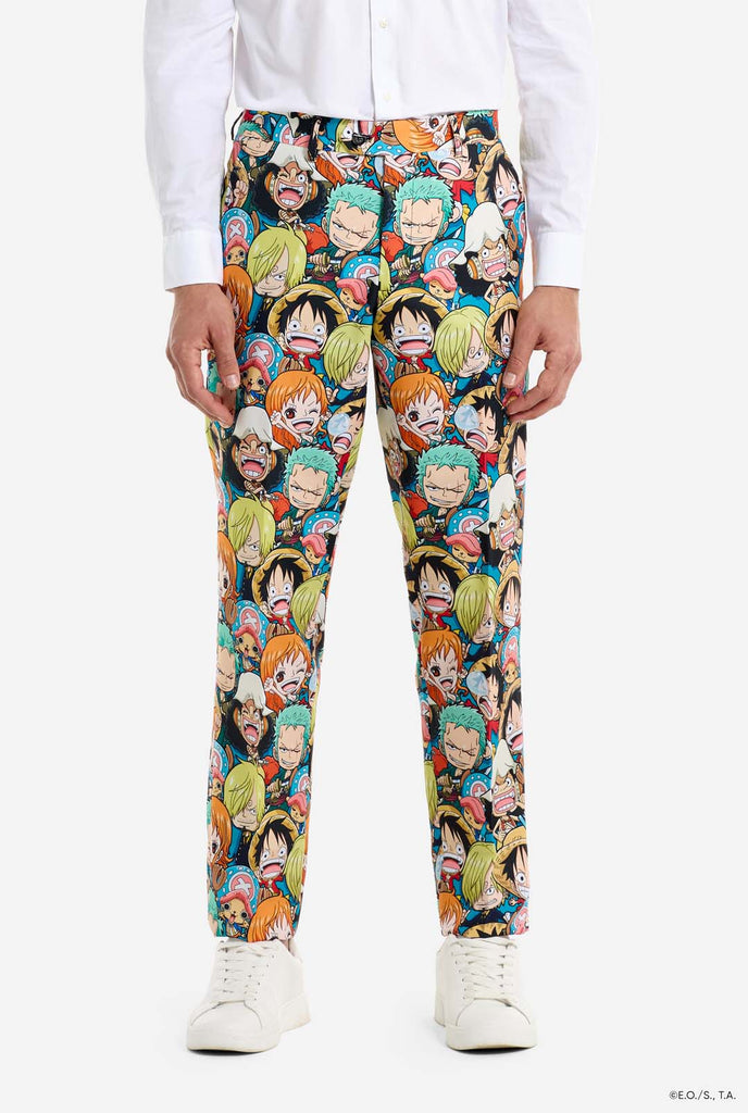 Man is wearing a men's suit with all over One piece print with One Piece characters. Pants close up.