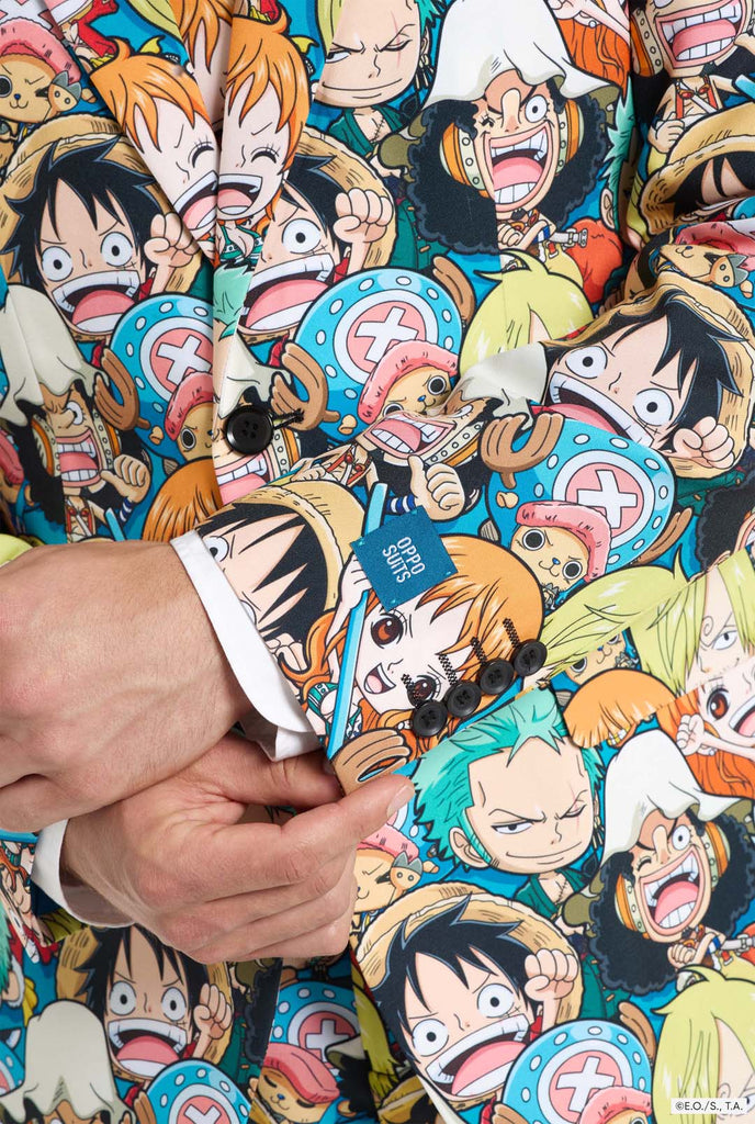 Man is wearing a men's suit with all over One piece print with One Piece characters. Sleeve close up.
