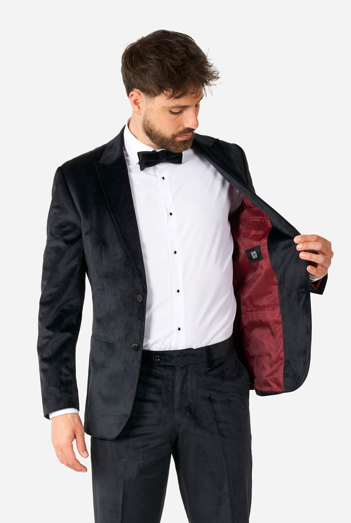 Man wearing black velvet tuxedo