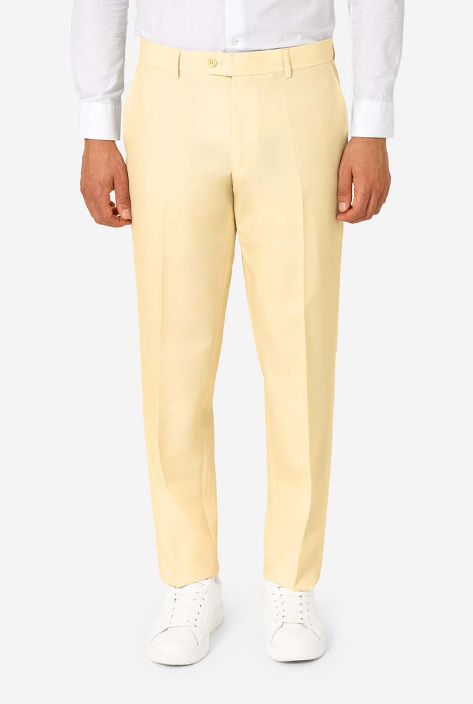 Elegant men's suit in a soft pastel yellow shade, perfect for weddings, summer events, and formal occasions. This stylish tailored suit features a slim fit design, notch lapels, and a matching tie for a sophisticated look. Ideal for modern gentlemen looking to make a statement with a light-colored pastel suit. Pants close-up.