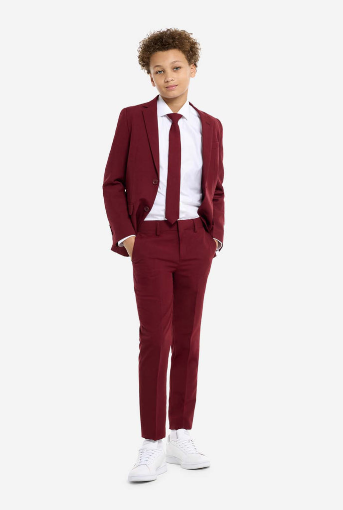 Teen wearing formal burgundy red suit