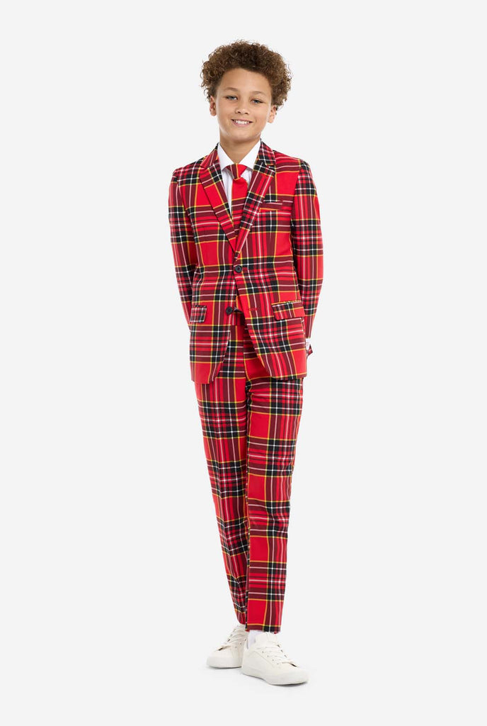 Teen wearing red tartan Christmas suit