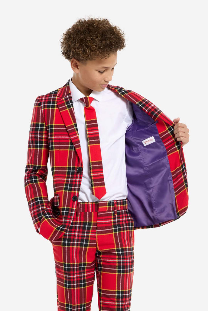 Teen wearing red tartan Christmas suit