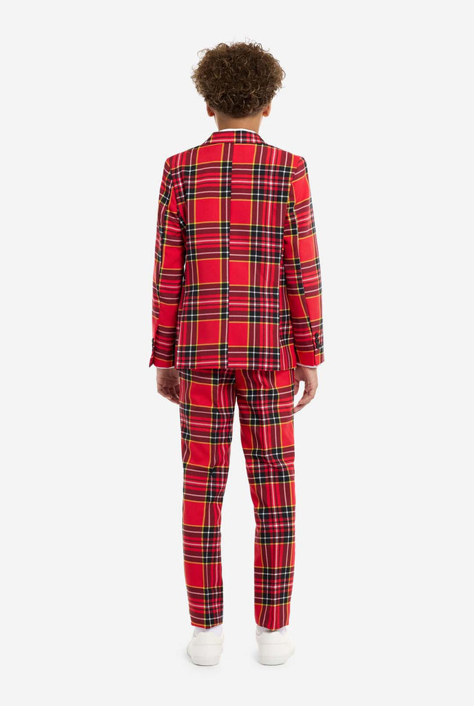 Teen wearing red tartan Christmas suit