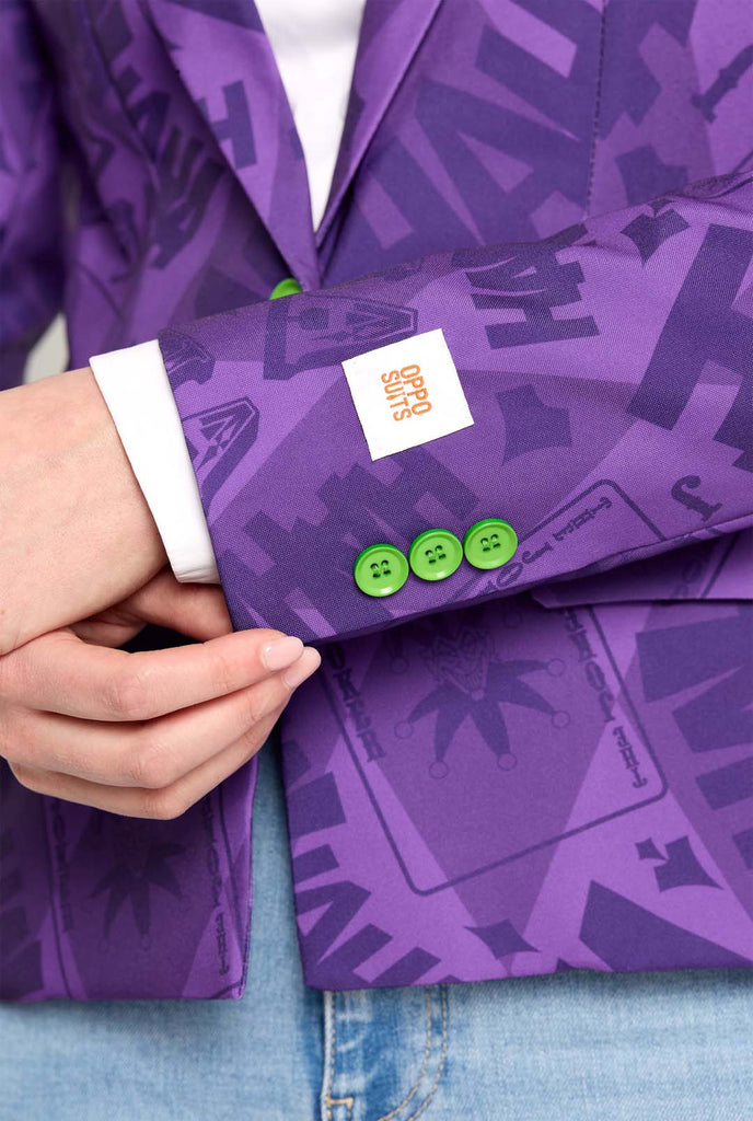 Woman wearing purple The Joker Themed womens blazer, close up