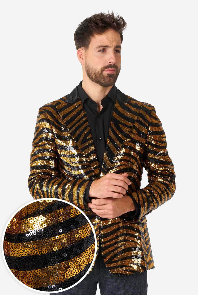 Man wearing black and gold sequins tiger stripe blazer