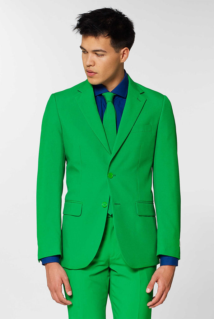 Man wearing evergreen, green men's suit and dress shirt