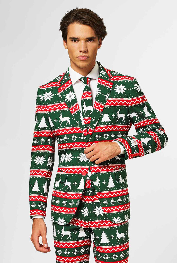 Video of green and red Christmas themed men's suit worn by man