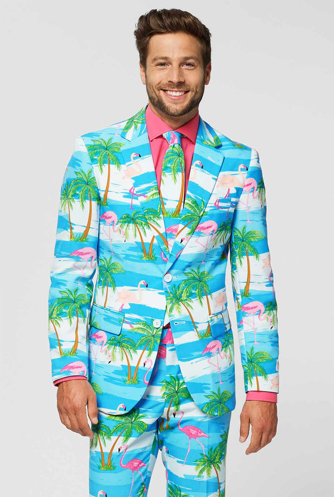 Video of blue and white men's suit with tropical flamingo print Flaminguy worn by man 