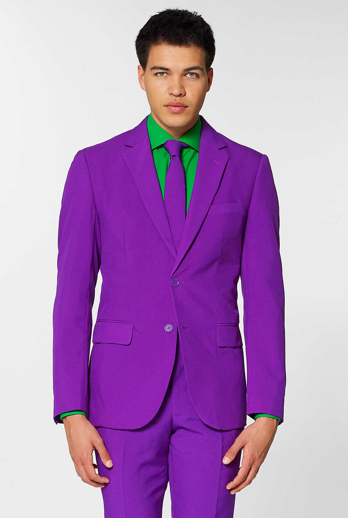 Video of man wearing purple men's suit and dress shirt